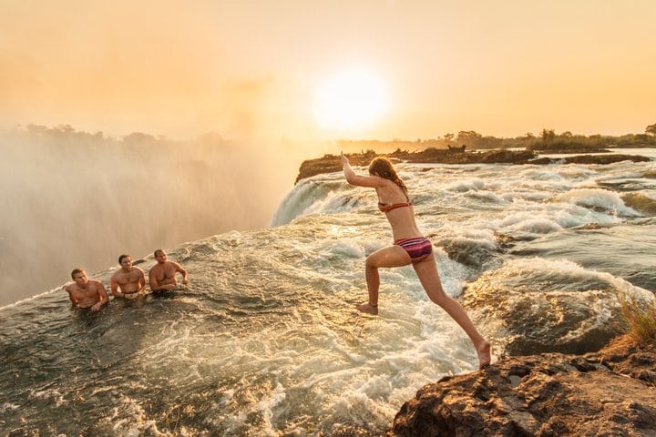 Jumping into Devils Pool, Victoria Falls, Zambia