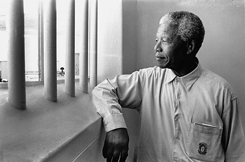 Nelson Mandela visiting his former prison cell on Robben Island in 1994