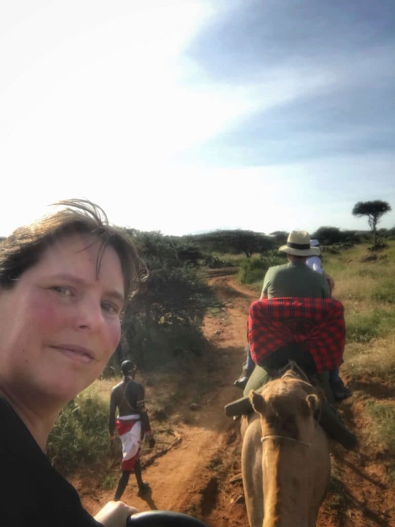 Lise atop her camel, taking a selfie to show just how high one sits on a camel!