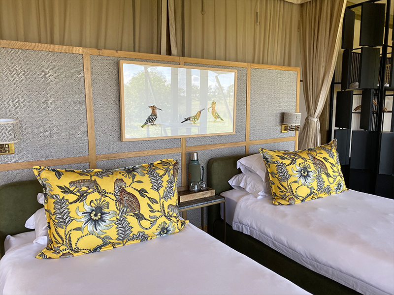 Beautiful bedroom decor comes alive with playful Ardmore textiles at Tuludi Camp in the Okavango Delta